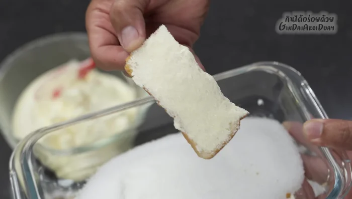 Generously sprinkle granulated sugar over the buttered bread.