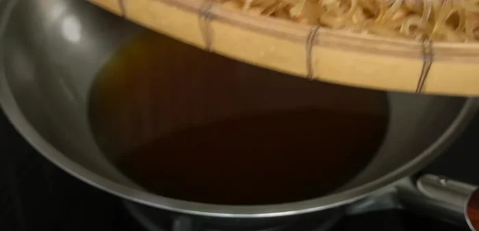 Heat oil in a frying pan over medium heat until hot.