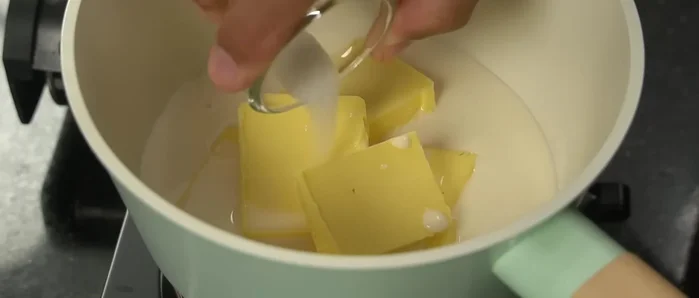 Melt butter in a pot or microwave. Add fresh milk, salt, and bring to a simmer.