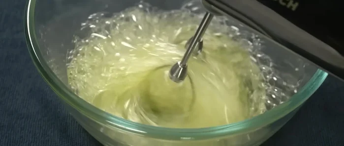 Beat egg whites with a handheld egg beater until soft peaks form. Gradually add sugar.