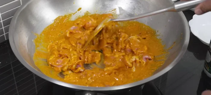 Add the sliced pork and stir-fry until it's about 80% cooked.