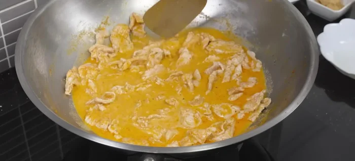 Simmer until the pork is cooked through and the sauce has thickened.