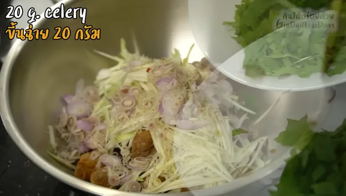 Combine the fried gourami, sour mangoes, shallots, lemongrass, celery, peanuts, and dressing. Mix well. (563.24)