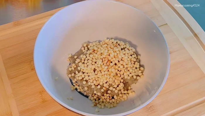 Combine filling ingredients: Add roselle seeds and roughly chopped carrots to the seasoned shrimp. Mix thoroughly.