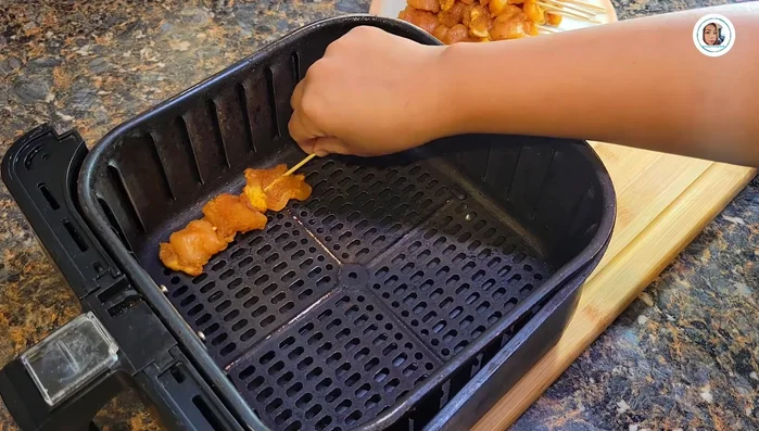 Grill or air fry the chicken skewers for about 3 minutes per side at 300°F (150°C).