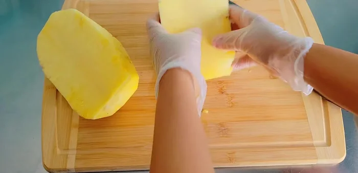 Prepare Pineapple Filling: Peel, core, and chop pineapples into small pieces. Squeeze out excess juice. Combine chopped pineapple, sugar, and salt in a pan. Stir over medium heat until cooked and dry.