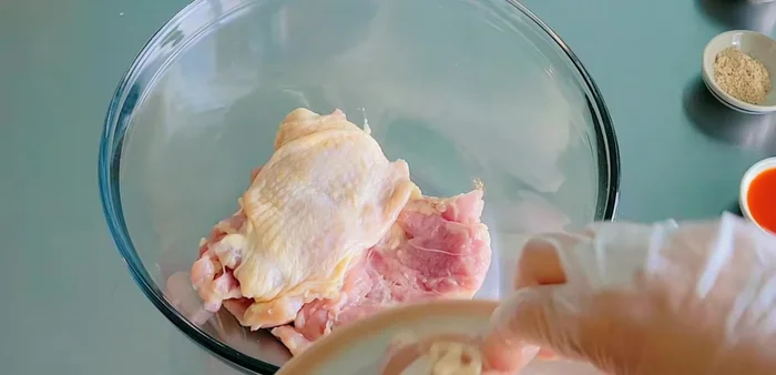 Remove bones from chicken thighs.