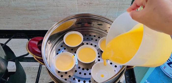 Pour the pumpkin mixture into the cups, leaving some space for the topping.