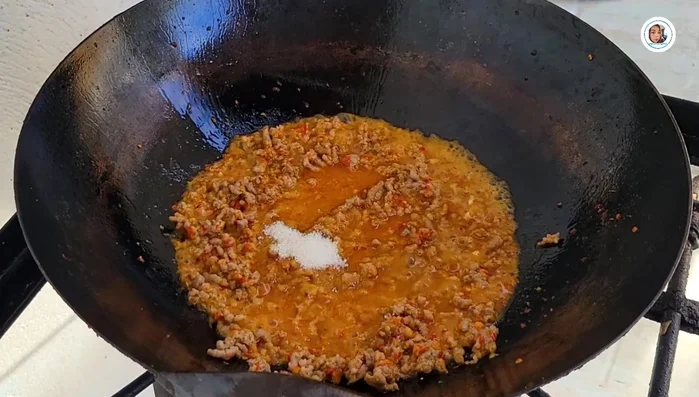 Add sugar, soy sauce, seasoning sauce, oyster sauce, and fish sauce. Adjust seasoning to taste. Add more salt if needed.