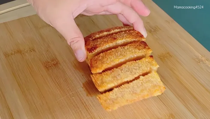 Cut fried pork belly into pieces.
