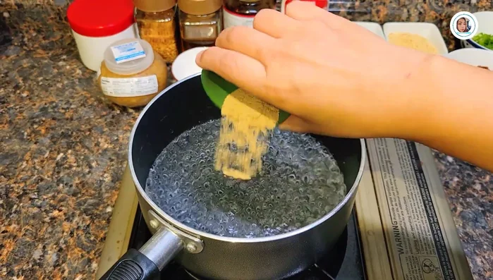 Prepare the pork: Chop the pork and boil it with water, seasoning powder, and soy sauce. (51.239)
