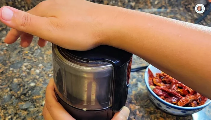 Blend the large dried chili peppers (or pound if preferred). Note: They may be roasted or fried first, but blending uncooked keeps the color brighter.