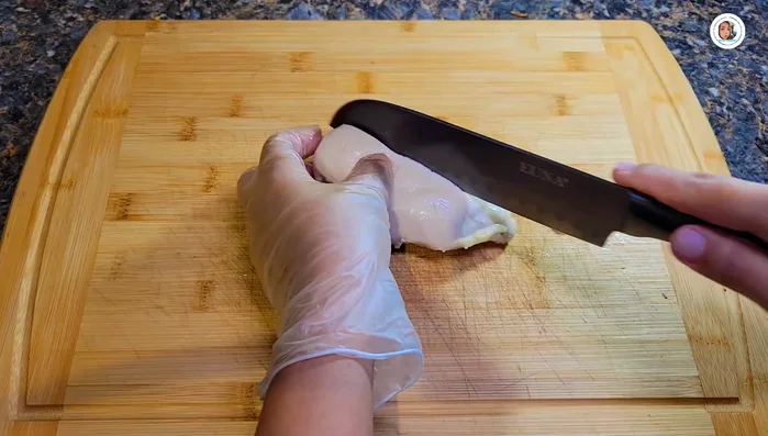 Cut the cooked chicken into small pieces.