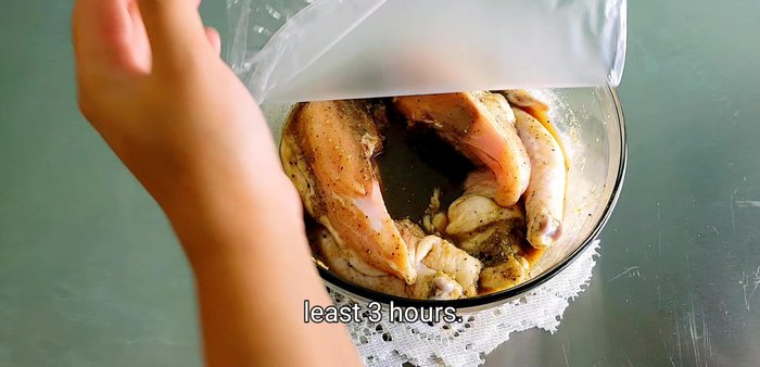 Marinate the chicken in the mixture for at least 3 hours, flipping it halfway through to ensure even marination. (115.079)