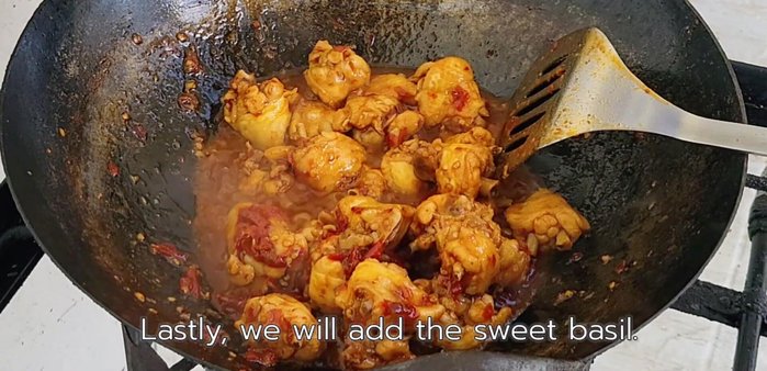 Add basil leaves (and/or kaffir lime leaves if desired) and stir-fry until wilted and well mixed.
