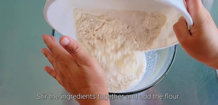 Add the wet ingredients to the dry ingredients and mix until a dough forms. Add more water if needed to achieve a slightly sticky but not wet dough.