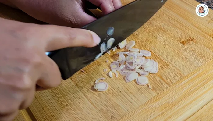 Prepare the side dishes: Thinly slice shallots, lemongrass, kaffir lime leaves, parsley.