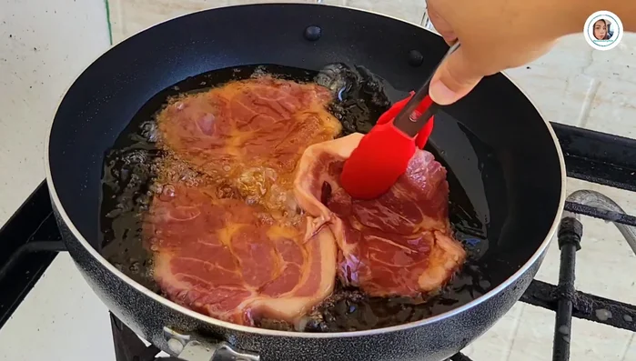 Fry the pork: Heat vegetable oil in a pan over medium heat. Fry the pork until cooked. Drain excess oil and set aside.