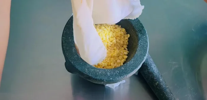 Pound or blend steamed mung beans until fine.