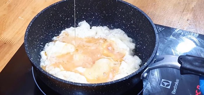 Pour the egg mixture into the pan with the cooked pork.