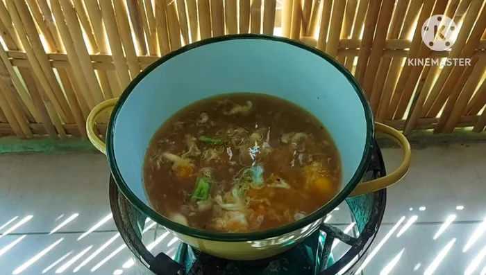 Add the blanched bitter melon to the boiling soup.