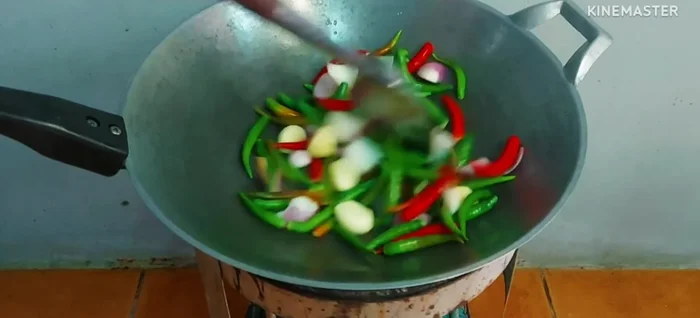 Roast chilies, shallots, and garlic until fragrant and slightly burnt.