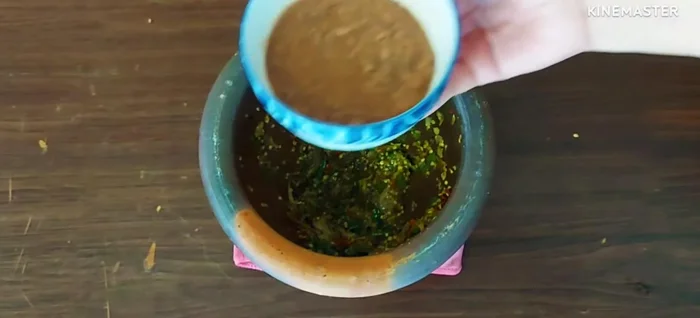 Add the dissolved shrimp paste to the pounded chilies, garlic, and shallots.