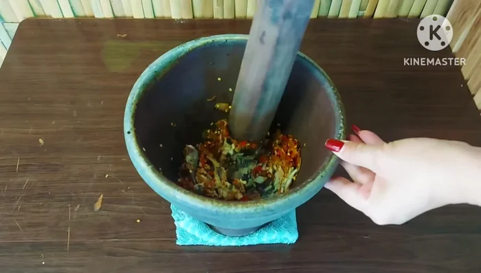 Pound the cooked mackerel until finely ground.