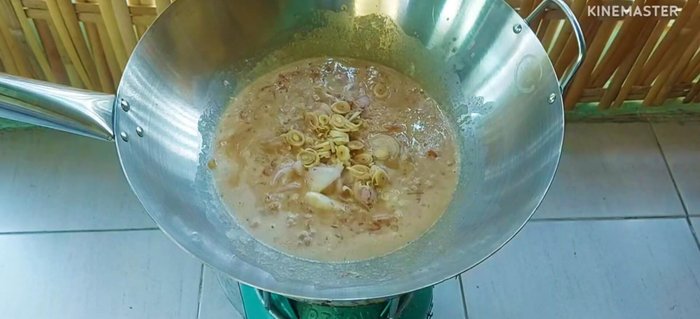 Add sliced shallots, lemongrass, and chili peppers (adjust to your spice preference).