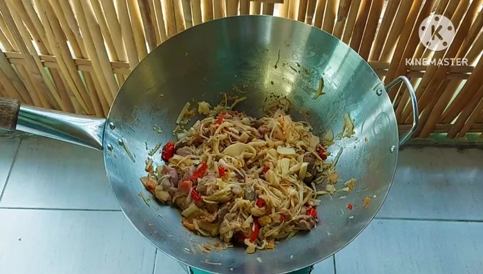 Add sliced lemongrass and torn kaffir lime leaves to enhance the aroma.