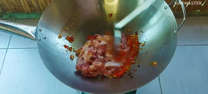 Add the chicken pieces and stir-fry until cooked.