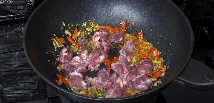 Add the marinated pork and stir-fry over medium heat until about 80-90% cooked.
