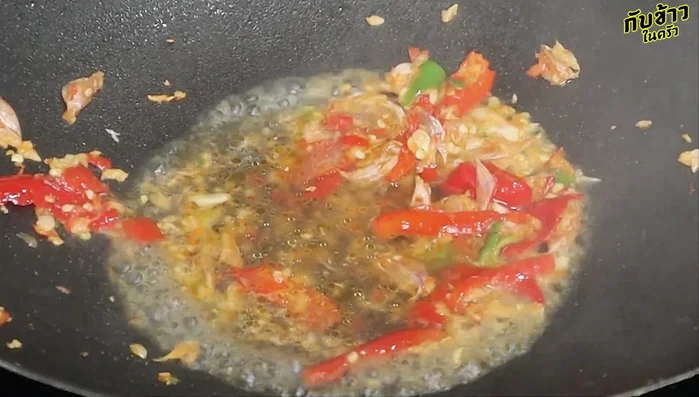 Add water to the pan and bring to a simmer. Add sugar, fish sauce, oyster sauce, and a little black soy sauce. Stir until well blended.