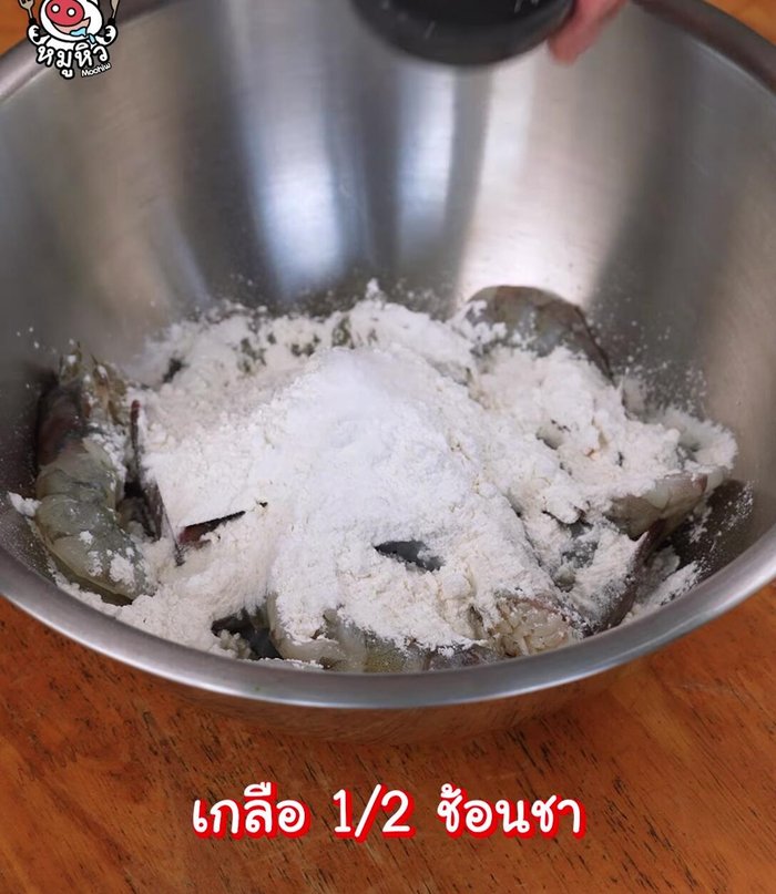 Deep fry shrimp until crispy, adding salt to enhance flavor.