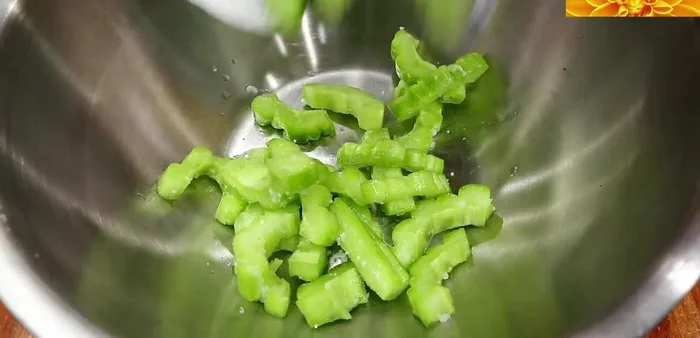 Add Bitter Melon: Add the bitter melon to the pot and sauté briefly.