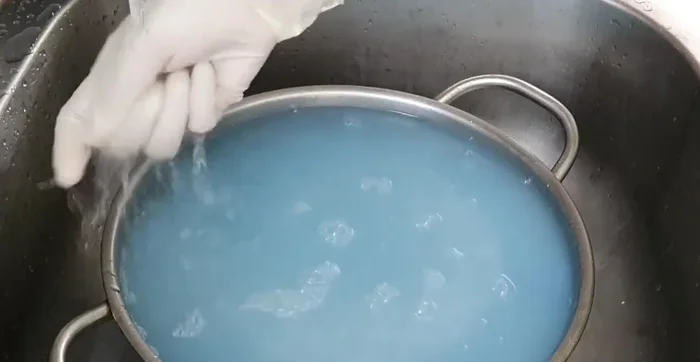 Rinse the rice again under cold running water until the water runs clear and the sticky residue is gone.
