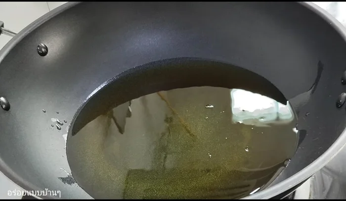 Heat the oil in a pan over medium-low heat. Once the oil is hot, add the chicken pieces. You can either submerge the chicken or fry it partially submerged.