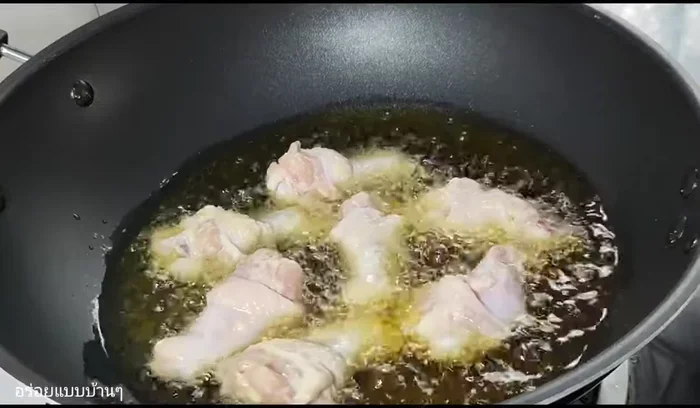 Fry the chicken until golden brown and crispy, flipping to ensure both sides are cooked evenly.