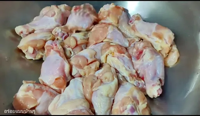 Prepare the chicken by piercing it all over with a fork to ensure even cooking. This helps the chicken cook easily during frying.