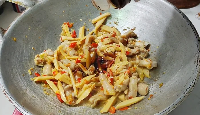 Season with oyster sauce, light soy sauce, dark soy sauce, and sugar. Stir-fry until well combined.