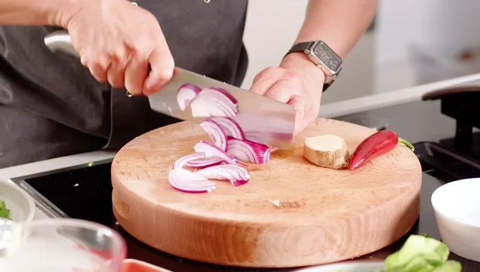 Prepare aromatics: thinly slice red onion, ginger (matchsticks), and chili. (120.24)