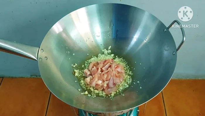 Add the chicken to the pan and stir-fry until partially cooked. (Substitute with pork or shrimp if desired).