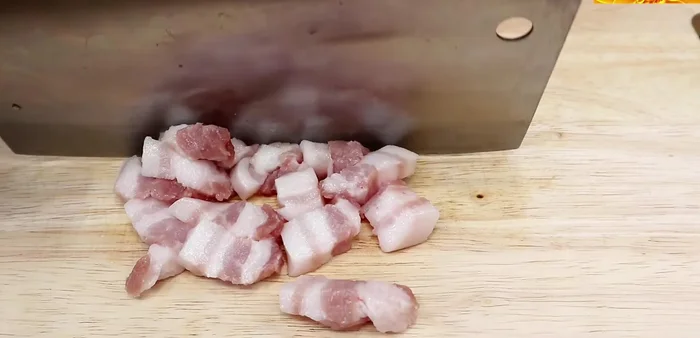 Heat oil in a wok. Add pork belly and stir-fry until cooked.