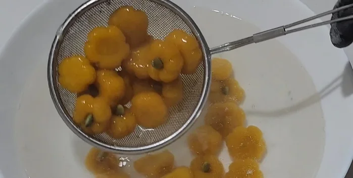 Remove the cooked bua loy and immediately transfer them to cold water to prevent sticking.