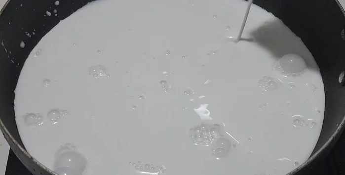 In a separate pot or container, combine coconut milk, sugar, salt, and young coconut meat.