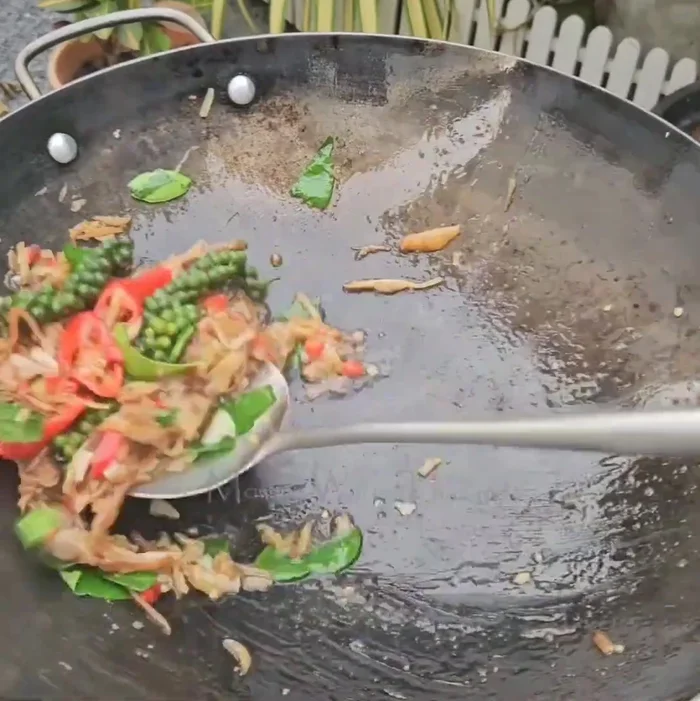 Stir-fry over high heat. Add pea eggplant and basil.