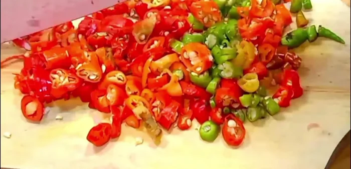 Finely chop the chilies.