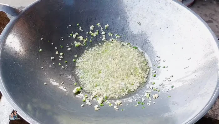 Add chopped chili peppers (adjust to taste) and stir-fry until fragrant and yellow.