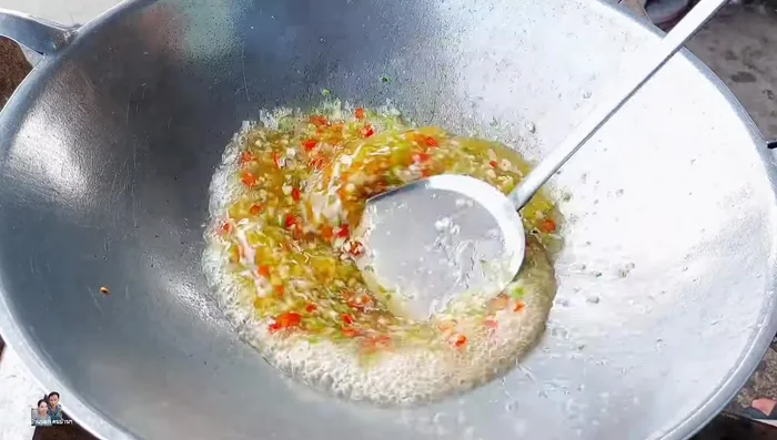 Add light soy sauce, fish sauce, oyster sauce, and optional chicken dipping sauce. Simmer to thicken the sauce.