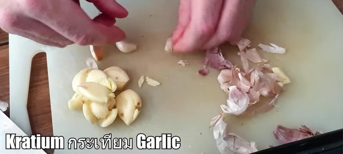 Crush garlic and remove some skin.
